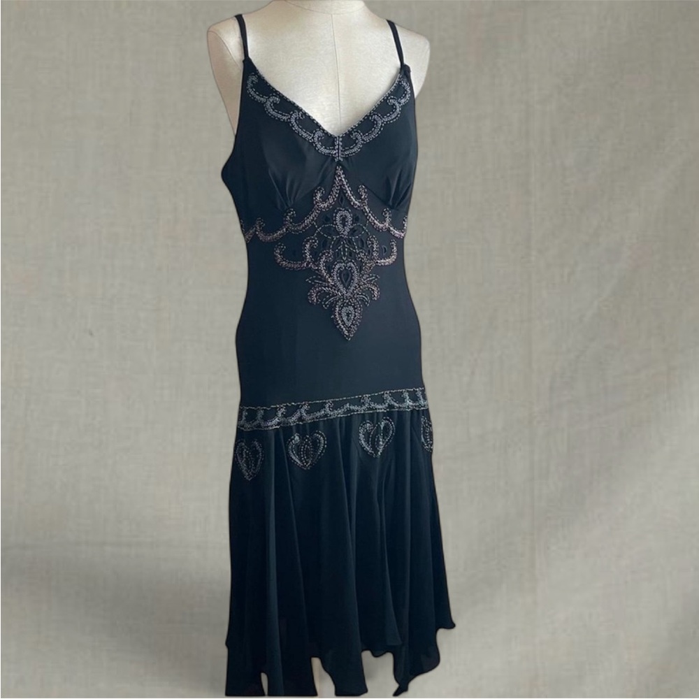 Black beaded v neck midi dress with a boho touch and flared asymmetrical skirt